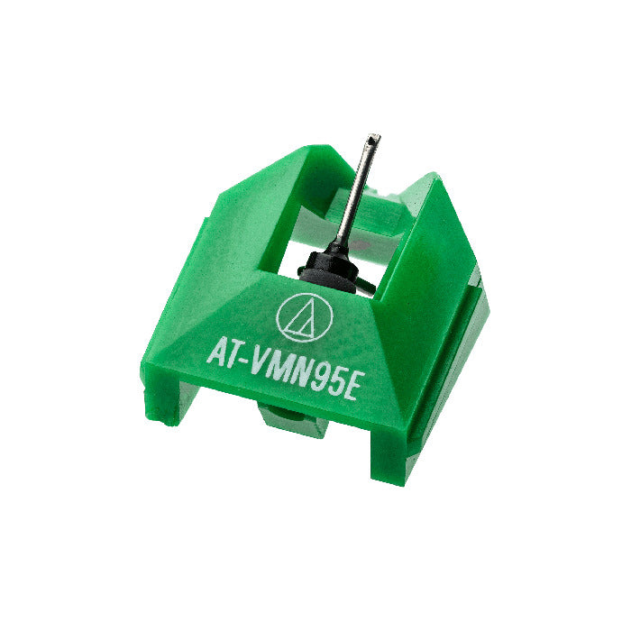 Audio Technica AT-VMN95E turntable stylus resting on a white background, showcasing its detailed needle and cartridge design.