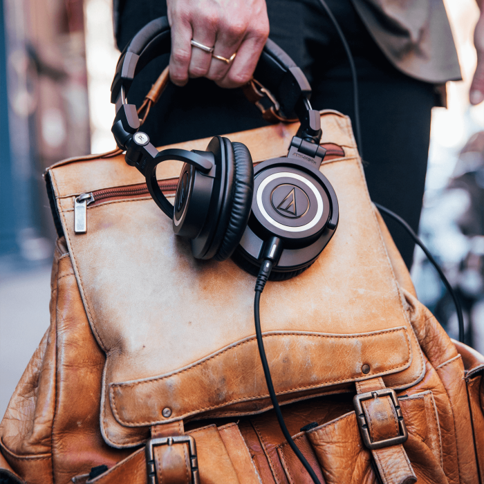 Audio Technica ATH-M50x studio headphones with large over-ear cups and adjustable headband, black color, designed for professional sound quality.