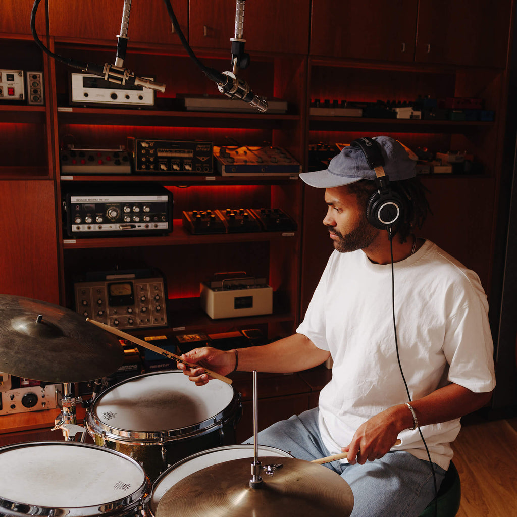 Audio Technica ATH-M50x studio headphones with over-ear design and cushioned ear cups, black color, and adjustable headband.