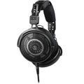 Audio Technica ATH-R50x studio headphones with over-ear design and large ear cups, shown in a close-up image.