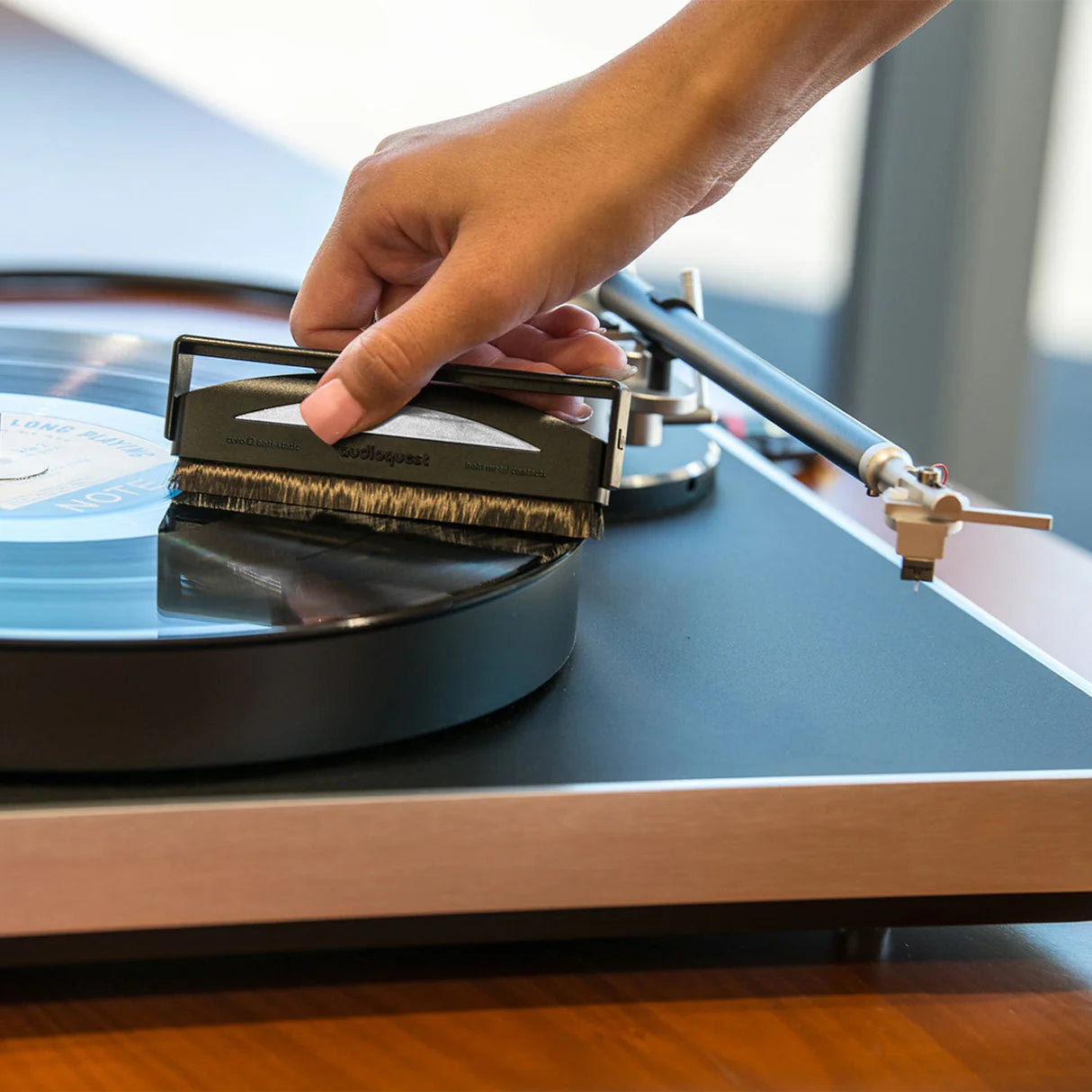 AudioQuest Silver Anti-Static Record Brush for cleaning vinyl records, featuring anti-static bristles for safe, effective record maintenance.