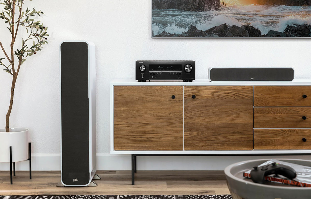 Denon AVC-S660H stereo amplifier with sleek black front panel, control knobs, and input ports visible on the front.