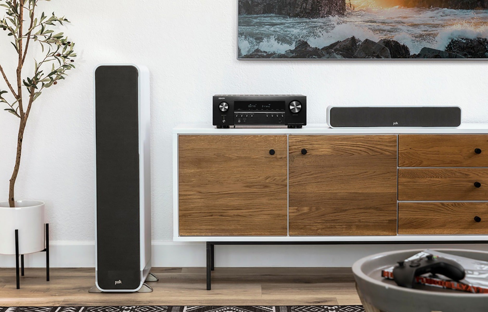 Denon AVC-S660H stereo amplifier with sleek black front panel, control knobs, and input ports visible on the front.