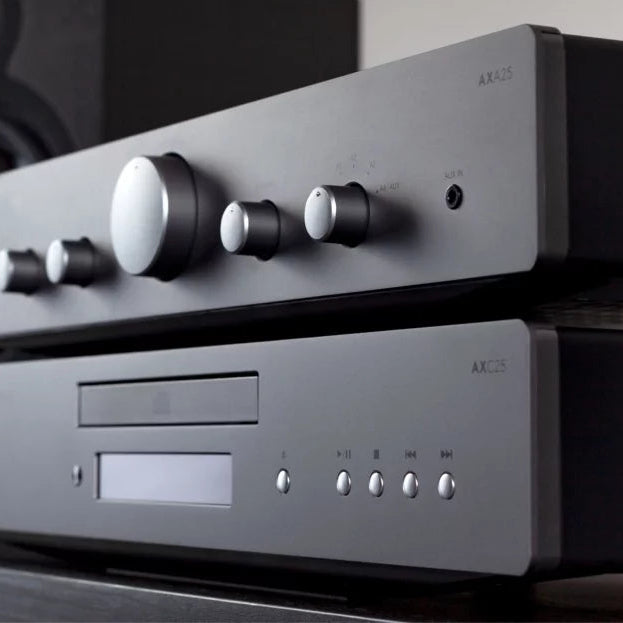 Cambridge Audio AXA25 stereo amplifier showing front panel with control knobs and input connections.