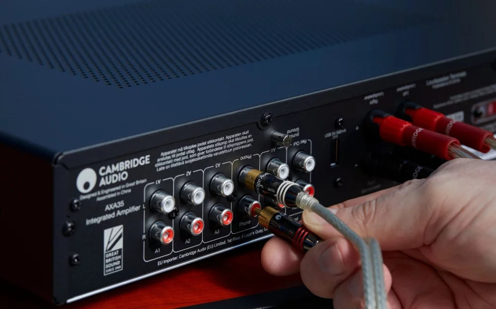 Cambridge Audio AXA35 stereo amplifier with front controls and sleek black design, ideal for high-quality home audio.