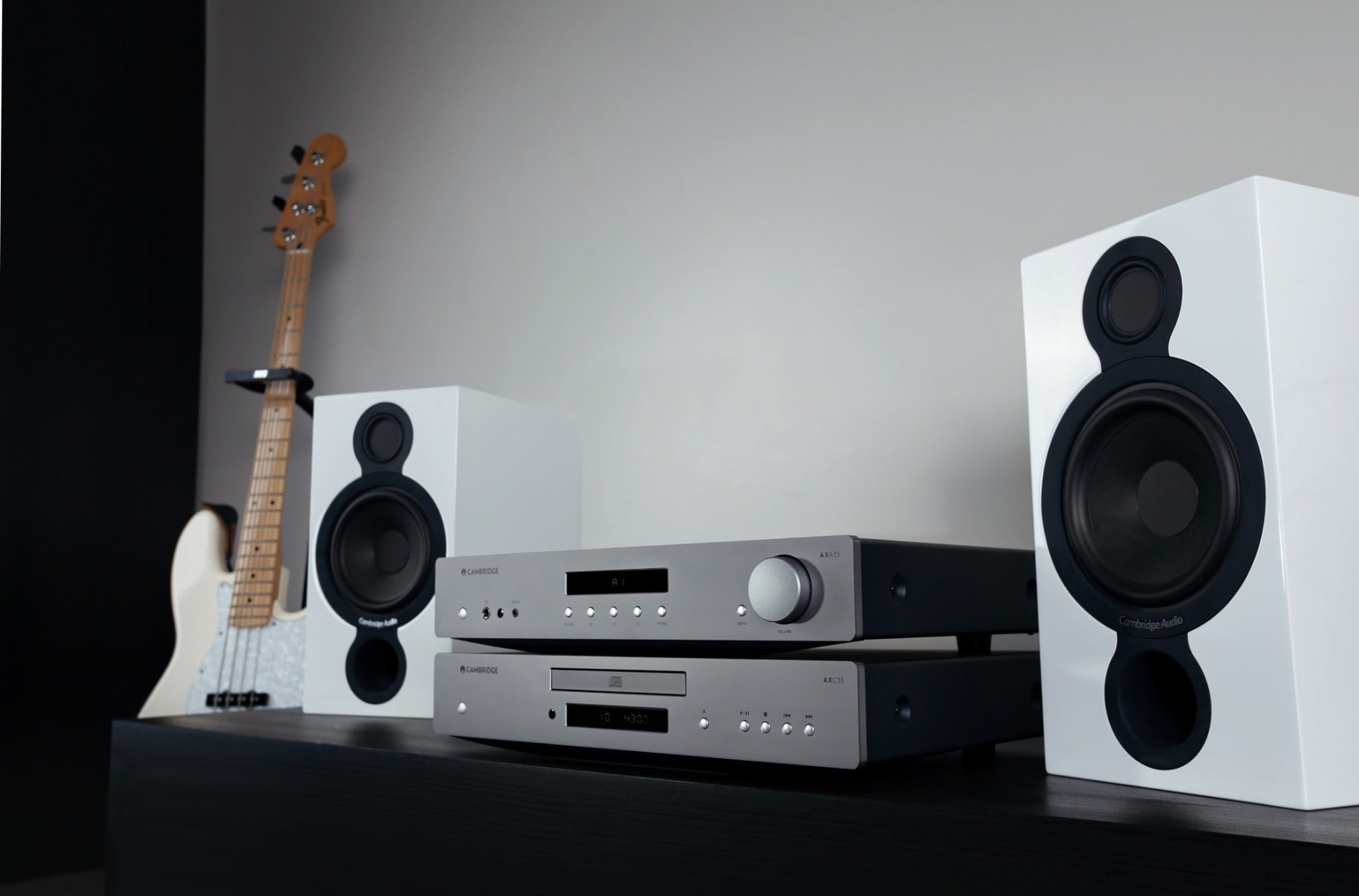 Cambridge Audio AXA35 stereo amplifier with black finish, front panel controls, and input selection buttons.
