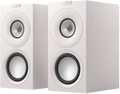KEF Q Concerto Meta passive bookshelf speakers shown in a stylish home setup, highlighting their sleek design and compact size.