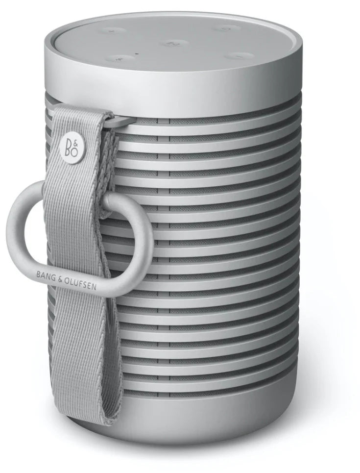Bang & Olufsen Beosound Explore portable speaker with back carabiner for easy outdoor use and secure attachment.