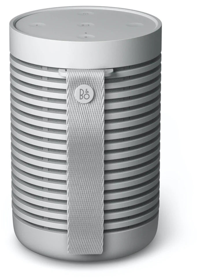 Bang & Olufsen Beosound Explore portable speaker with back strap, showcasing its rugged design and durable outdoor-ready build.