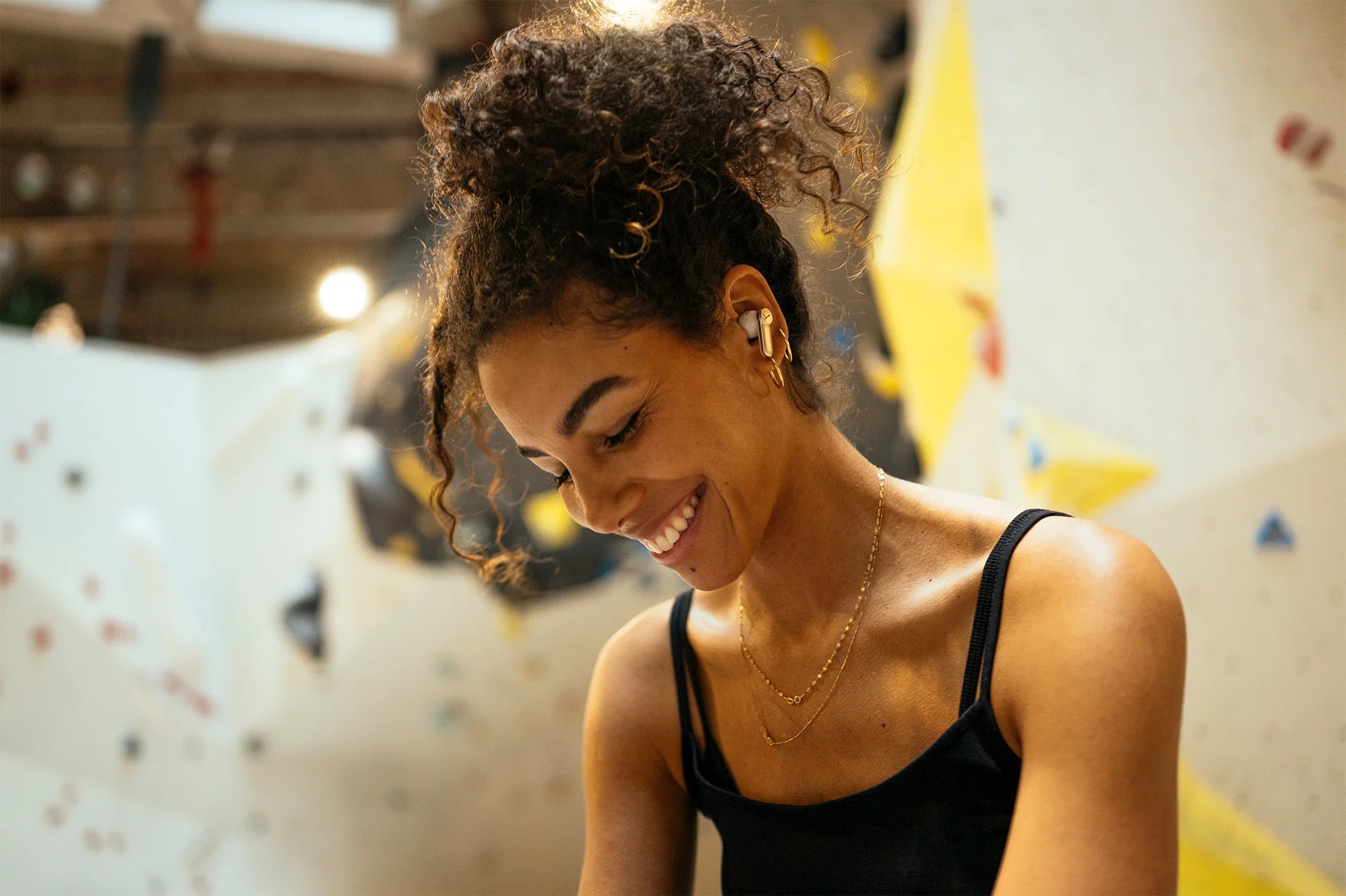 Wireless Beyerdynamic Amiron 100 in-ear headphones with sleek design and in-ear tips, shown in close-up on a neutral background.