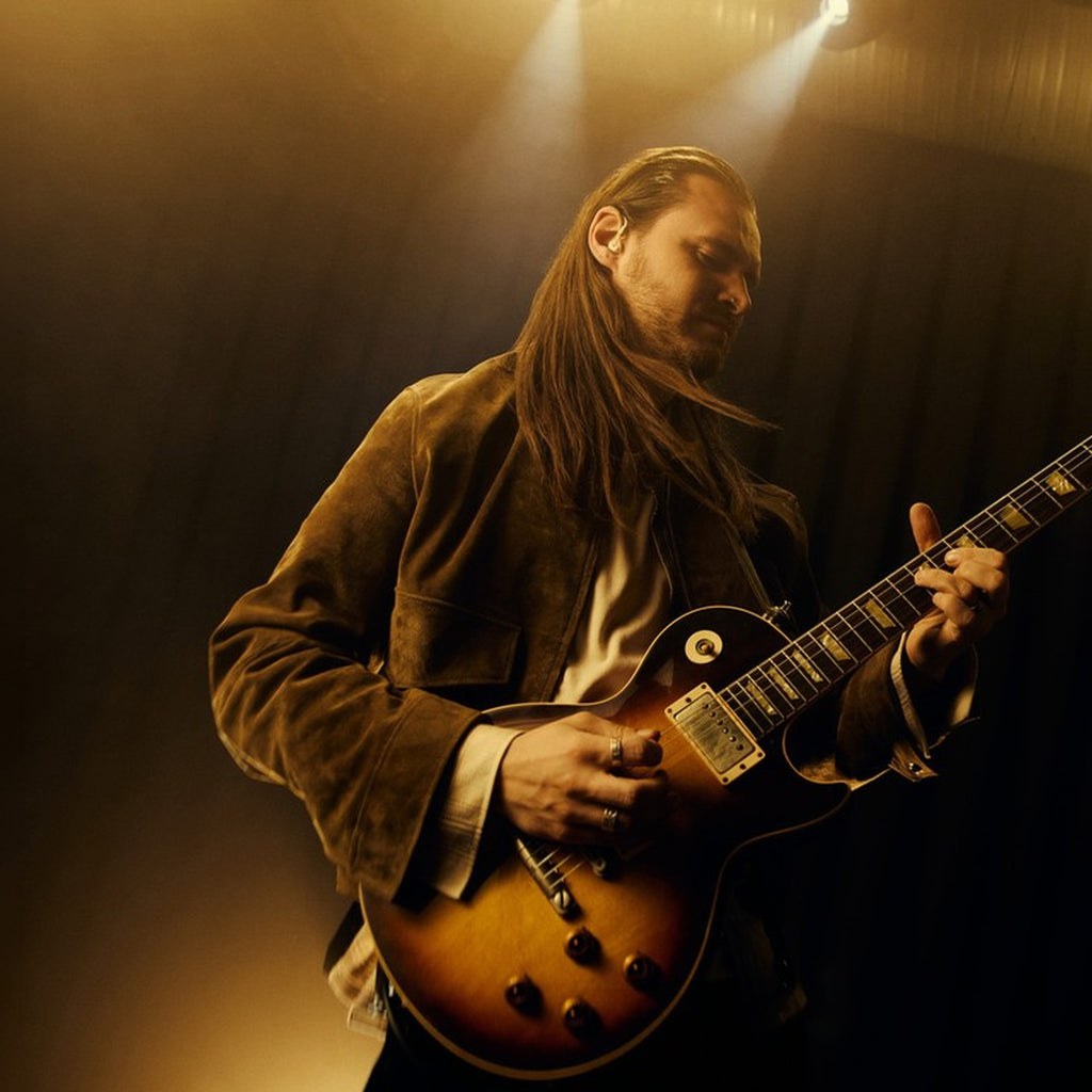 Beyerdynamic DT 30 IE in use, guitarist performing on stage with in-ear monitors