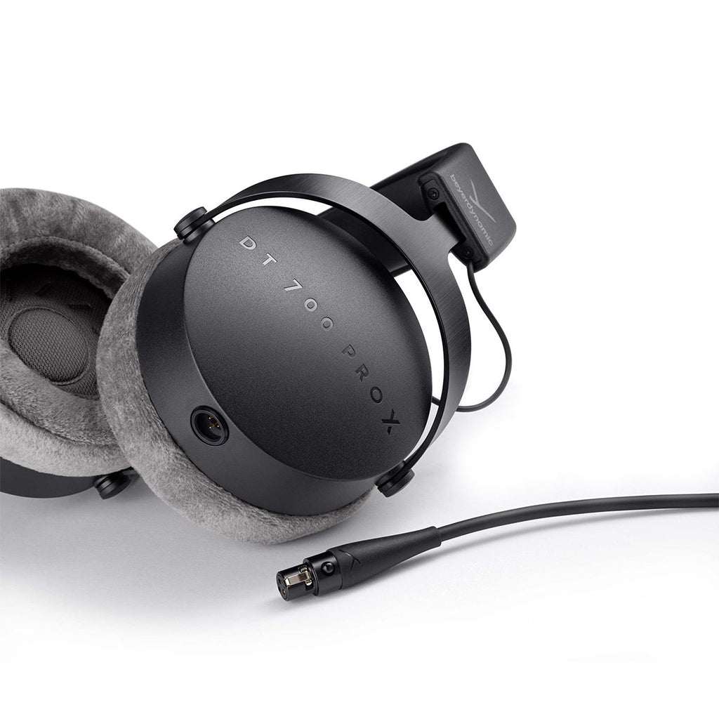 Beyerdynamic DT 700 Pro X studio headphones shown from a side perspective with over-ear design and adjustable headband.