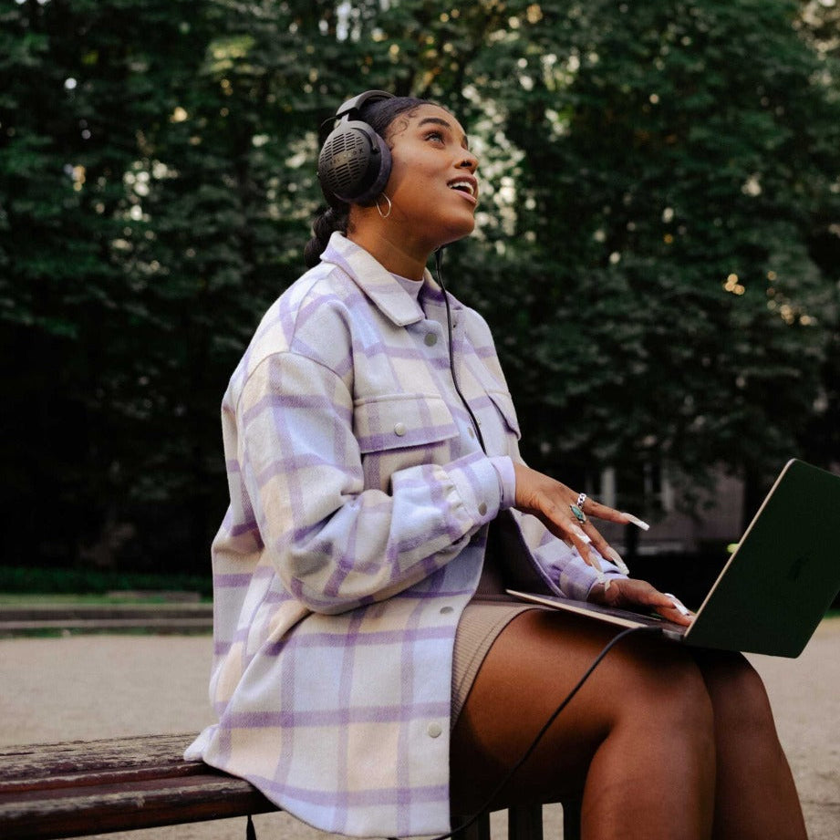 Beyerdynamic DT 900 Pro X studio headphones with over-ear design and adjustable headband, shown in black.