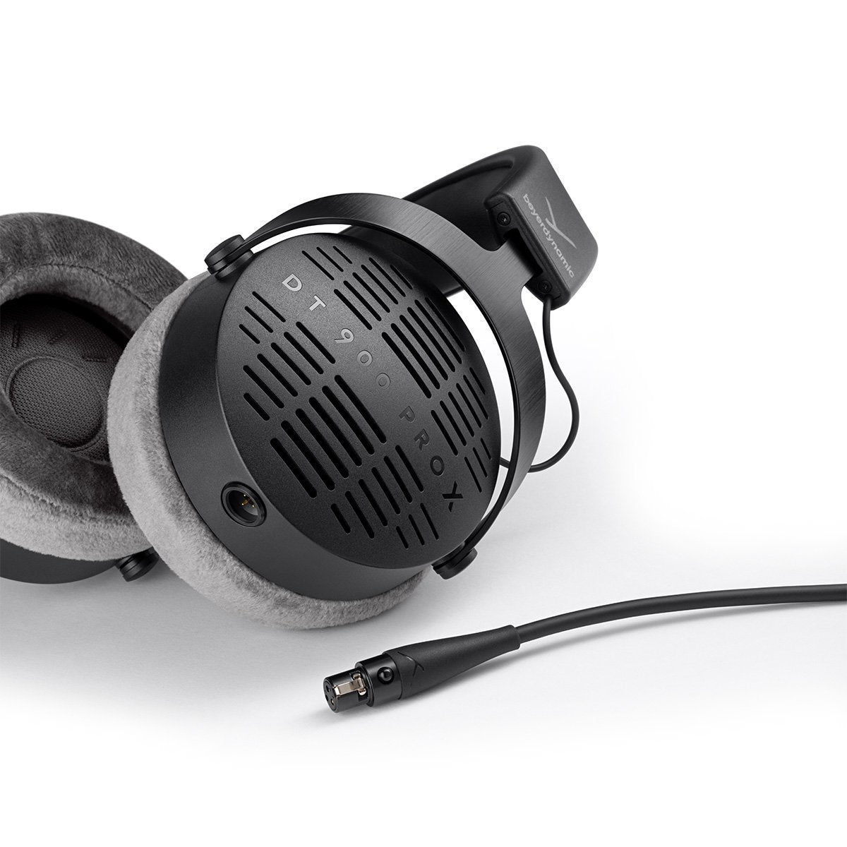 Beyerdynamic DT 900 Pro X studio headphones shown from a side perspective with ear cups and adjustable headband.