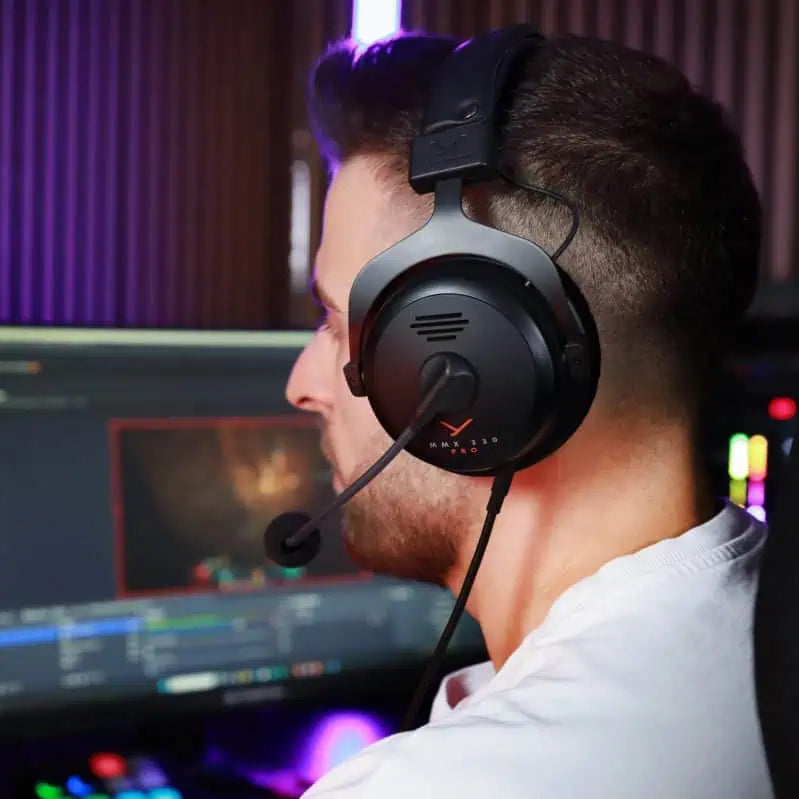 Beyerdynamic MMX 330 Pro gaming headphones with over-ear design and adjustable headband, shown in the image.