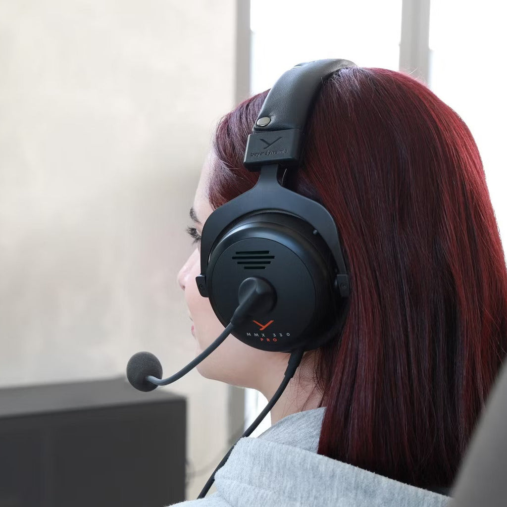 Beyerdynamic MMX 330 Pro gaming headphones with over-ear design, microphone, and padded ear cups for immersive gaming audio.