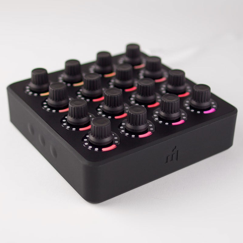 Black DJ TechTools MIDI Fighter Twister MIDI controller with colorful knobs and buttons for music production and DJing.