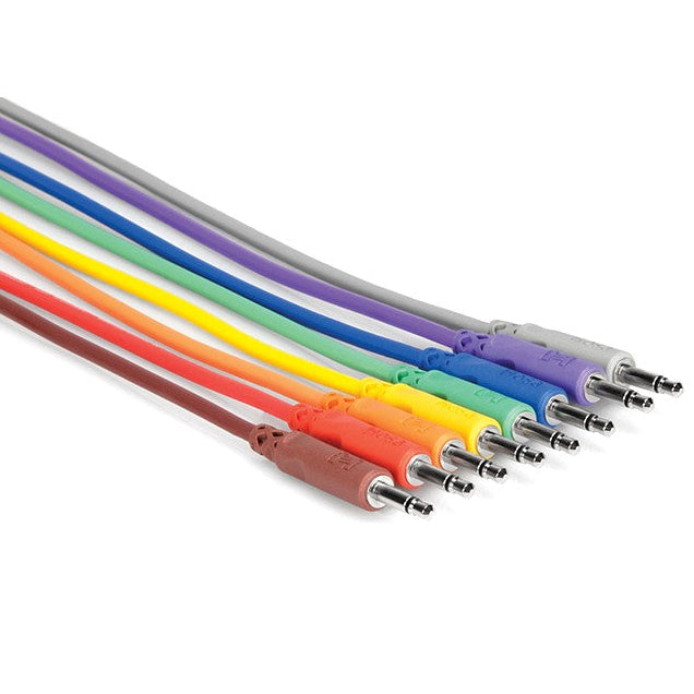 Set of eight Hosa CMM-830 3.5mm TS unbalanced patch cables, 0.3 meters long, arranged in a neat group.