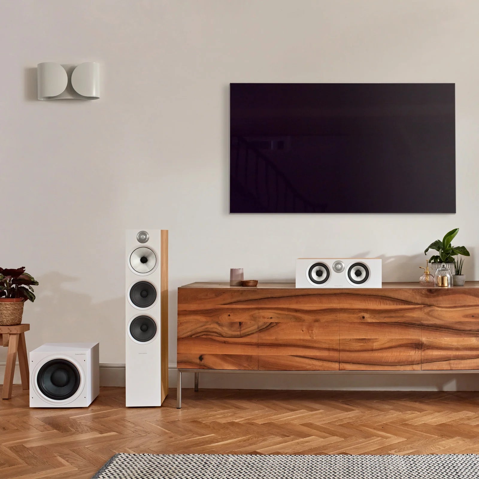 Bowers & Wilkins ASW608 subwoofer in white, showing the front view with a sleek design and speaker grille.