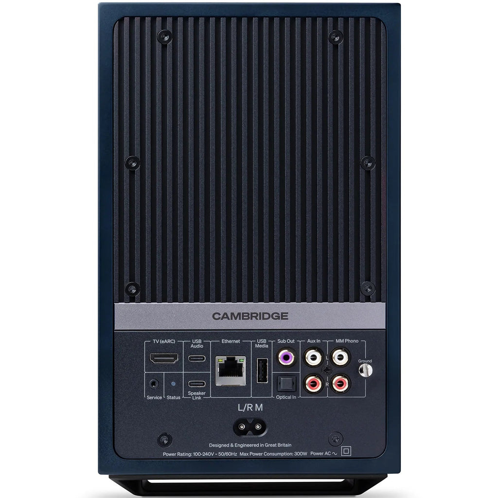 Cambridge Audio L/R M active bookshelf speakers in blue, showing front view with speaker grilles and control knobs.