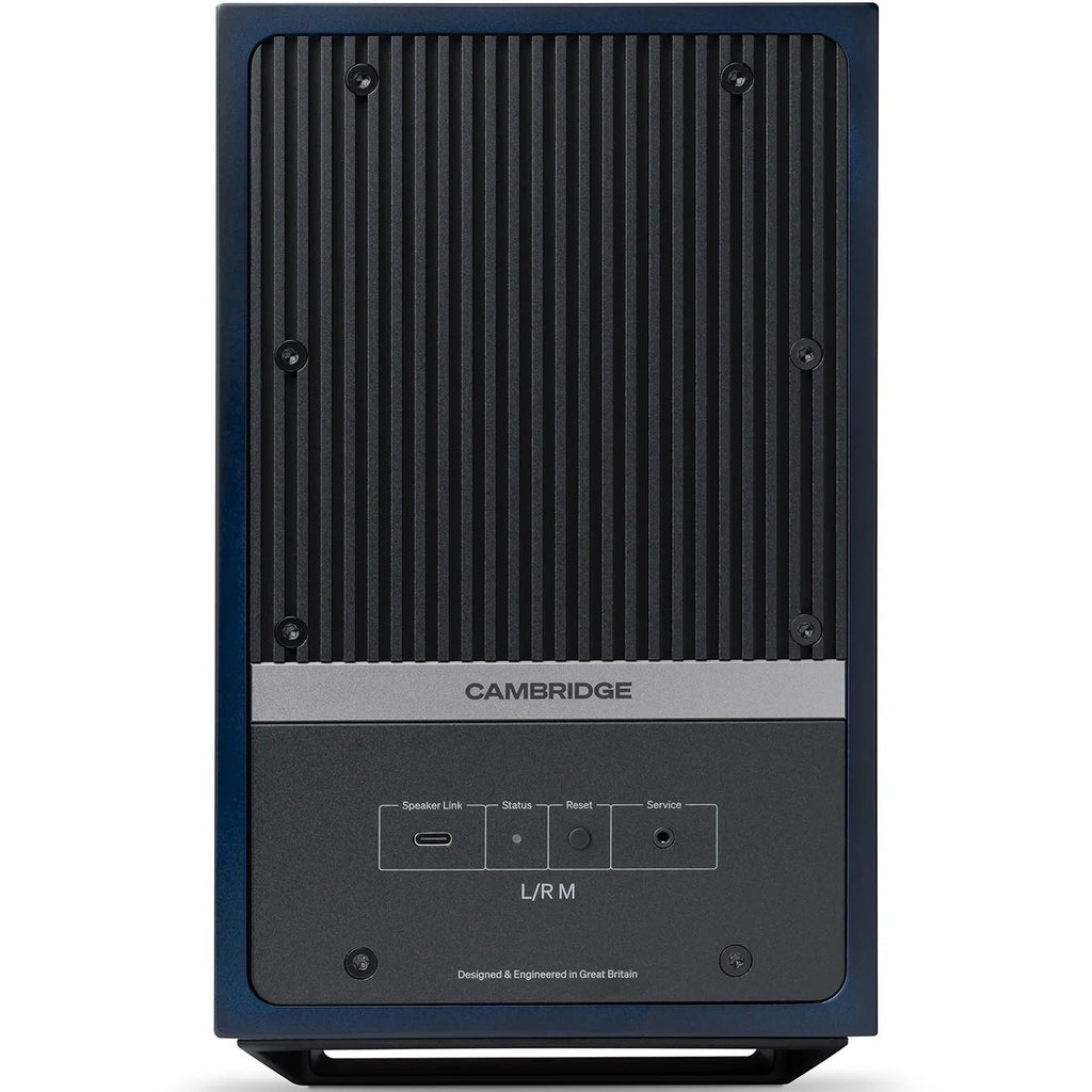 Cambridge Audio L/R M active bookshelf speakers in blue, showcasing a sleek design with front-facing drivers and a compact form.