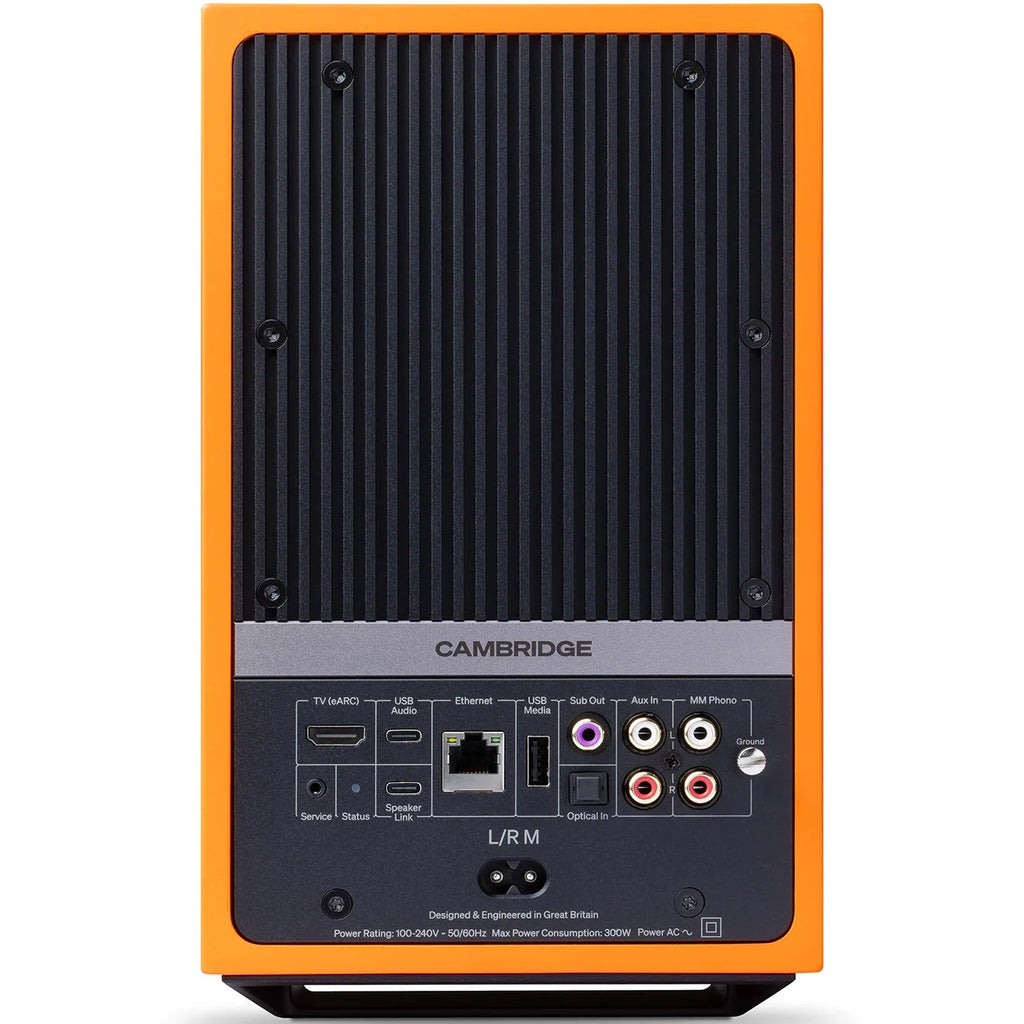 Cambridge Audio L/R M active bookshelf speakers with orange finish, showcasing sleek design and front-facing drivers.