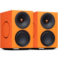 Cambridge Audio L/R M active bookshelf speakers in vibrant orange with sleek design and front-facing drivers.