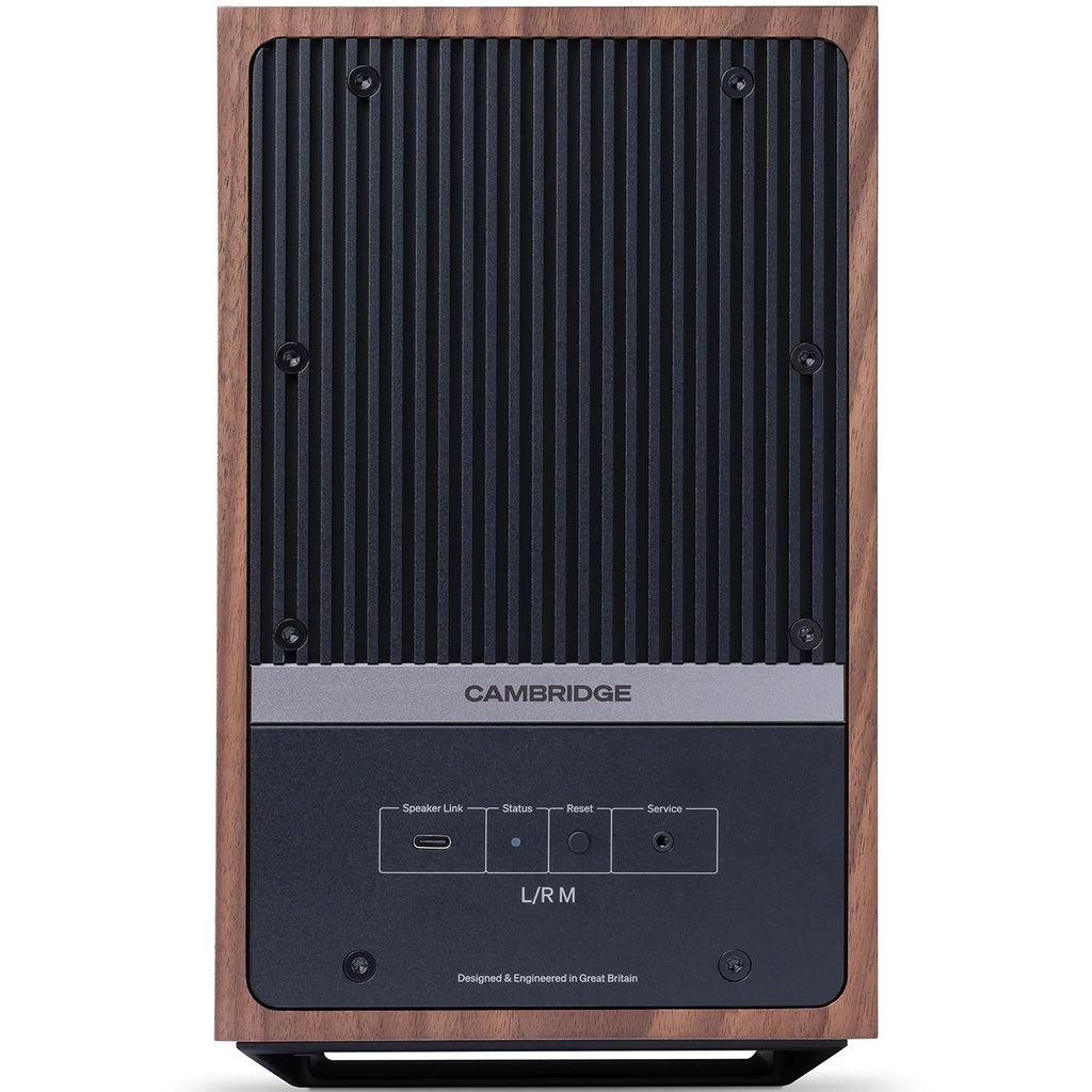 Cambridge Audio L/R M active bookshelf speakers in walnut finish, showcasing the sleek design and compact size.