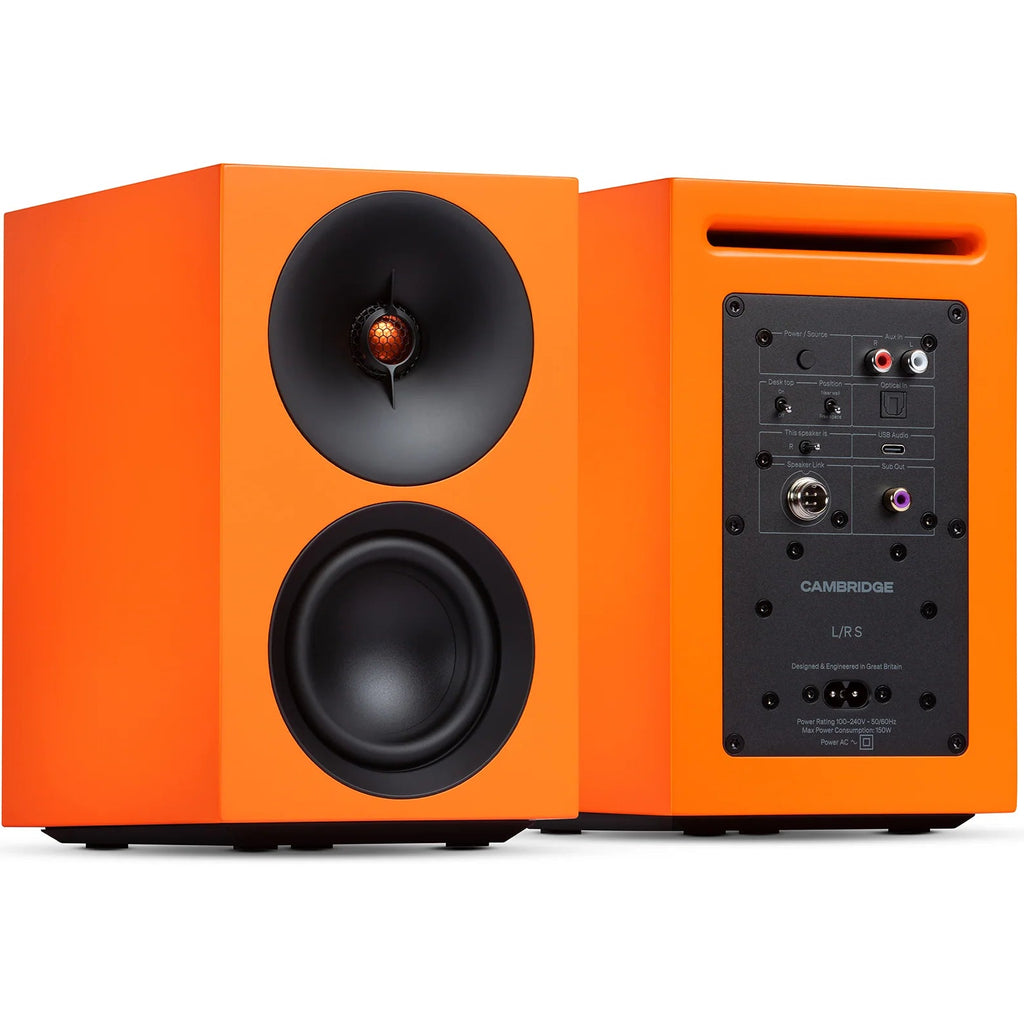 Cambridge Audio L/R S active bookshelf speakers in vibrant orange with sleek design and front-facing speaker drivers.