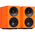 Cambridge Audio L/R S active bookshelf speakers in vibrant orange, showcasing sleek design and compact size for high-quality sound.
