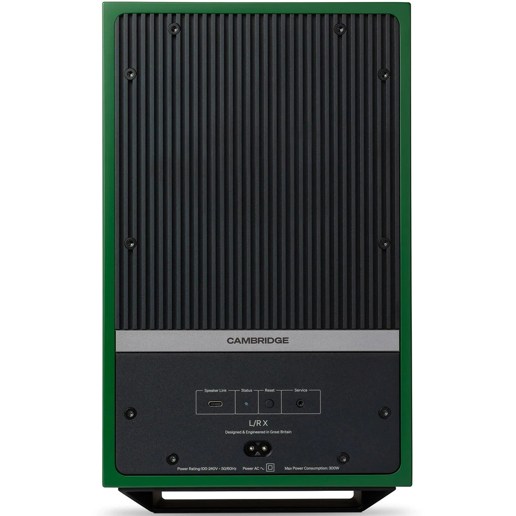 Cambridge Audio L/R X active bookshelf speakers in green, showing sleek rectangular design with speaker grilles and control knobs.