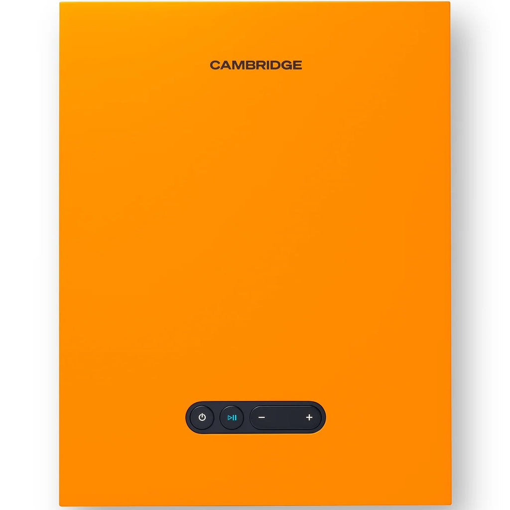 Cambridge Audio L/R X active bookshelf speakers in vibrant orange, showcasing their sleek design and compact size.