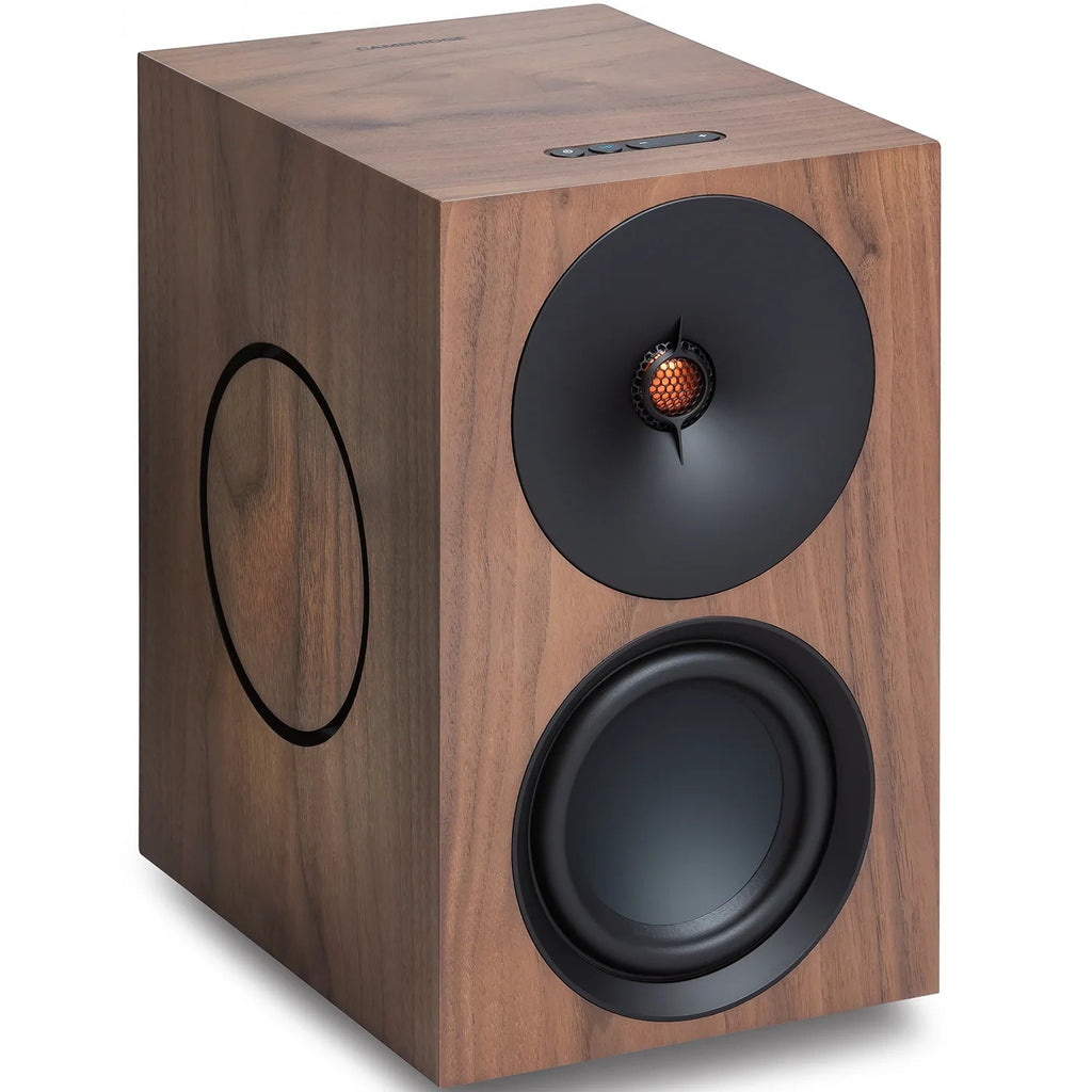 Cambridge Audio L/R X active bookshelf speakers in walnut finish, showing front view with speaker grille removed.