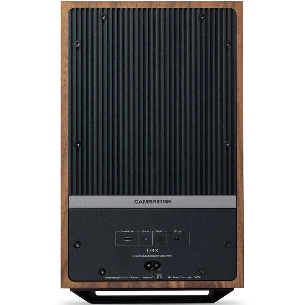 Cambridge Audio L/R X active bookshelf speakers in walnut finish, showcasing sleek design and front-facing drivers.
