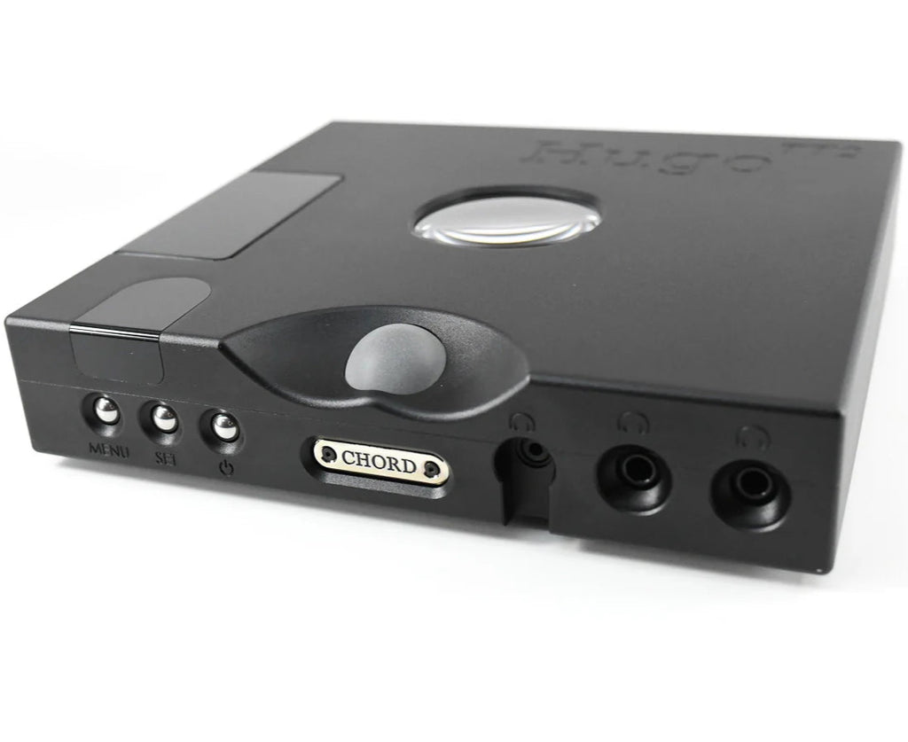 Chord Electronics Hugo TT2 headphone amplifier and DAC in black, showing front panel with digital displays and control knobs.