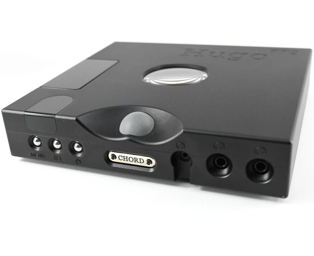 Chord Electronics Hugo TT2 headphone amplifier and DAC in black, showing front panel with digital displays and control knobs.
