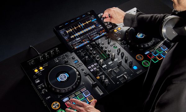 Pioneer DJ XDJ-RX3 DJ media player with dual large touchscreen and professional controls, used for DJ performances and mixing.