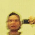 Canary yellow vinyl LP of Mac DeMarco's "Some Other Ones" by Captured Tracks, featuring colorful record and album cover.