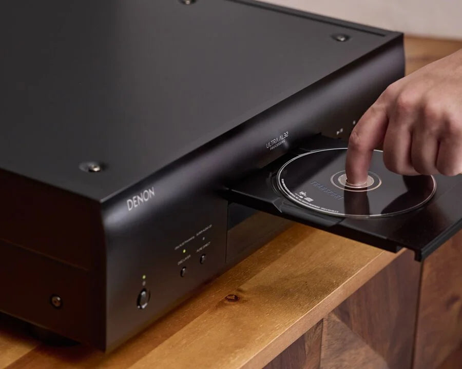 Denon DCD-3000NE high-end CD player with sleek black design and digital display, showcasing premium audio equipment.