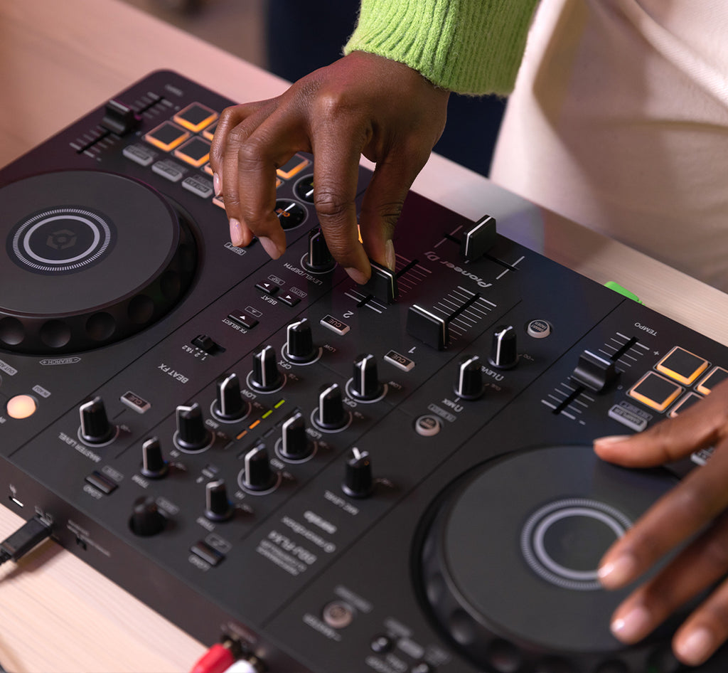 Pioneer DJ DDJ-FLX4 DJ controller with jog wheels, faders, and control panels for mixing and DJing.