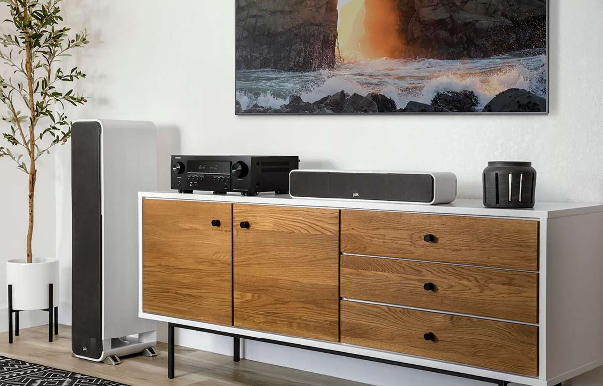 Denon AVR-S660H stereo amplifier with black front panel, multiple input ports, and control knobs on top.