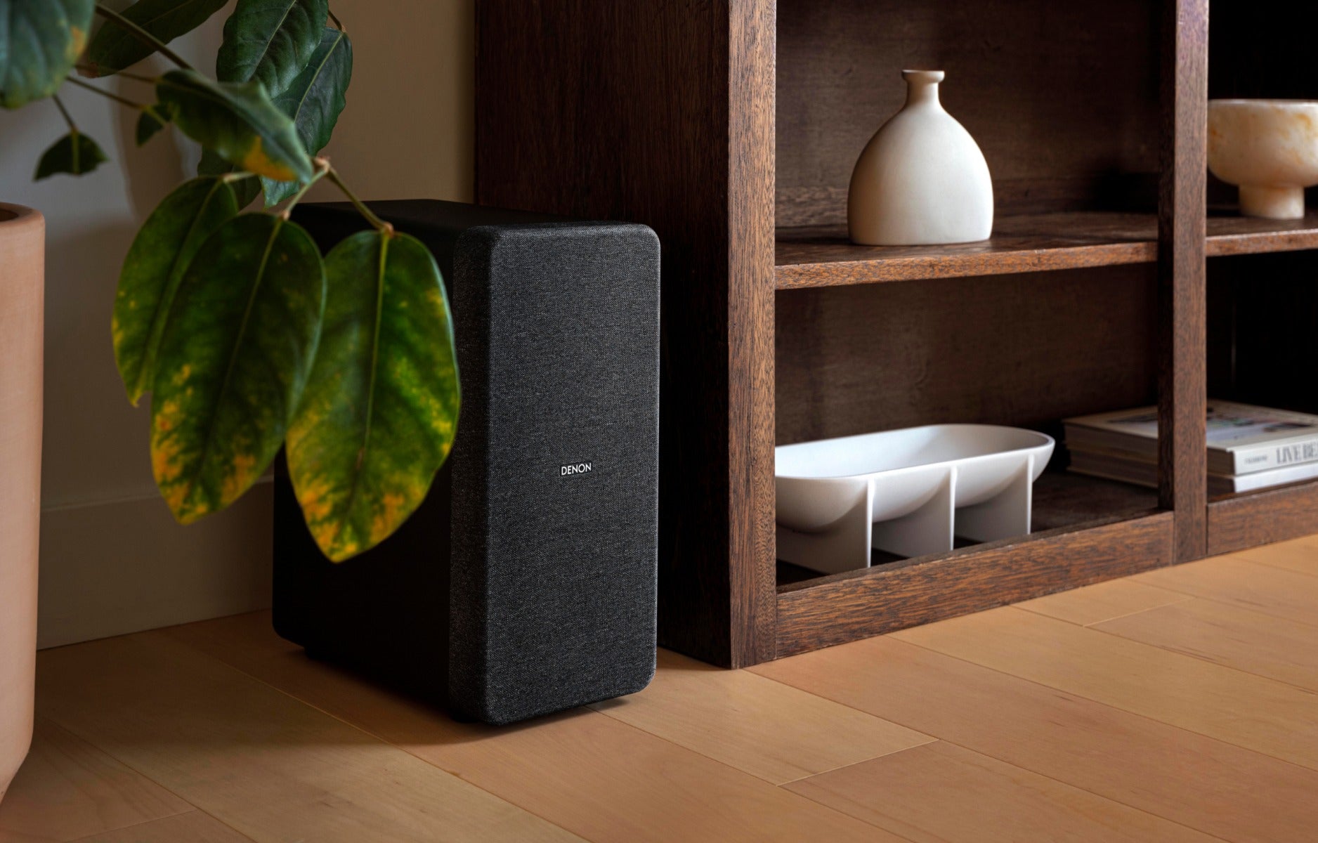 Denon DHT-S517 soundbar with sleek black design and multiple speaker drivers for immersive TV audio experience.