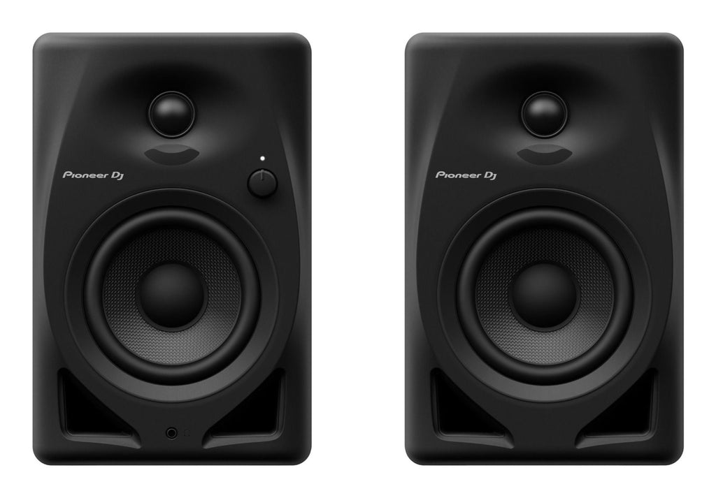 Pioneer DJ DM-40D desktop speakers shown from the front, featuring black enclosures and control knobs for audio adjustment.