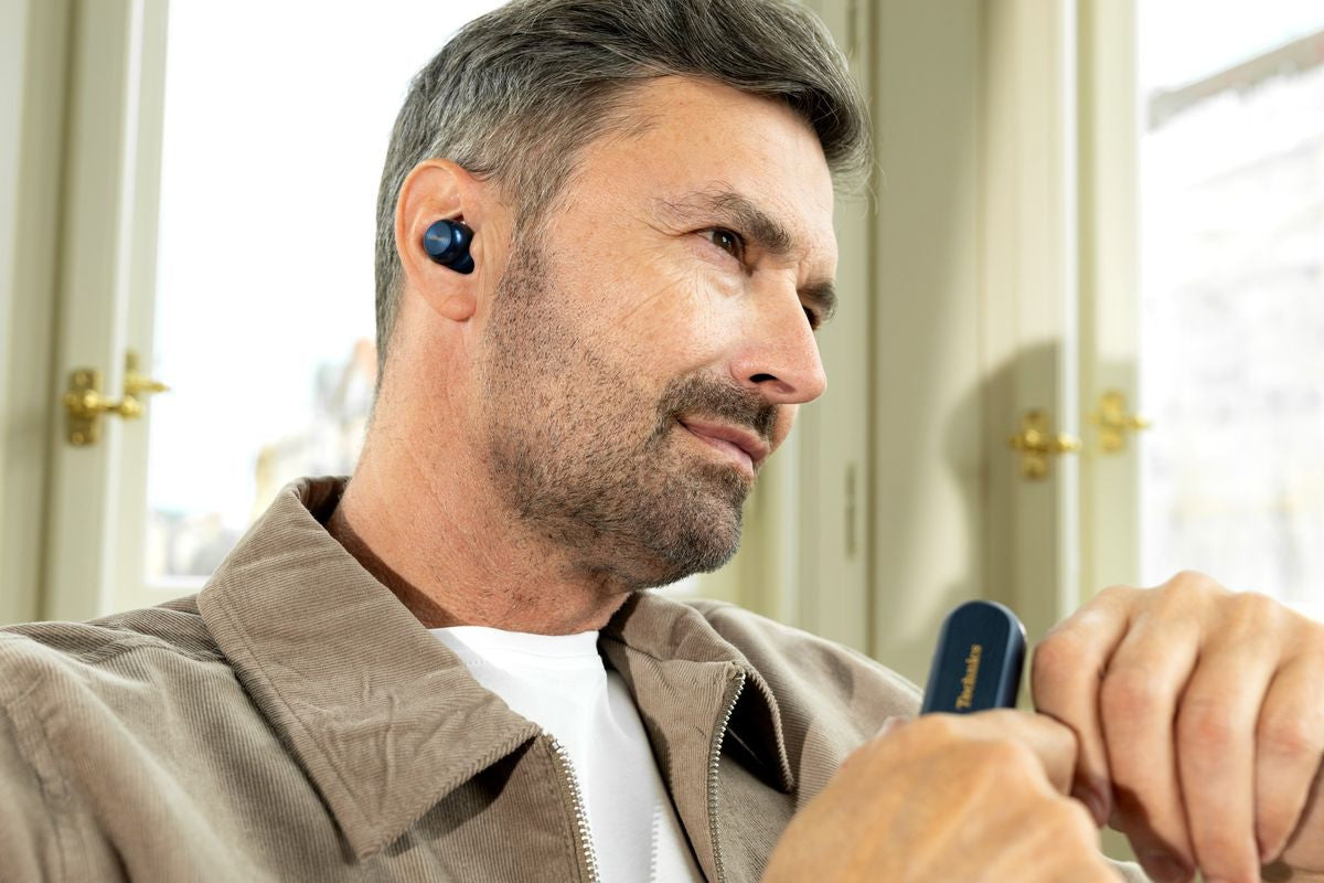 Wireless In-Ear Headphones Technics EAH-AZ100 with sleek black design and comfortable ear tips, close-up view of the earbuds.