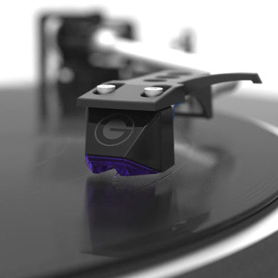 Goldring E3 turntable cartridge mounted on a tonearm, showcasing its gold-colored body and stylus for high-quality vinyl playback.