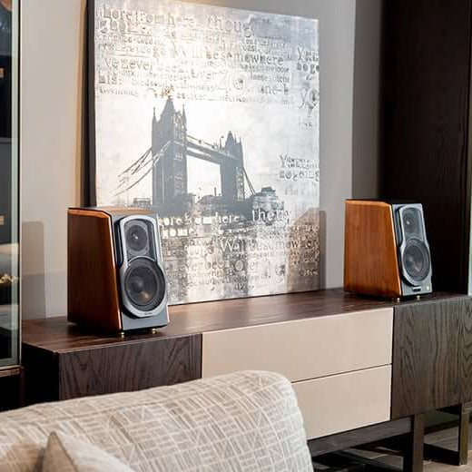 Edifier S1000MKII desktop speakers with wooden cabinets and modern controls, positioned on a desk setup.