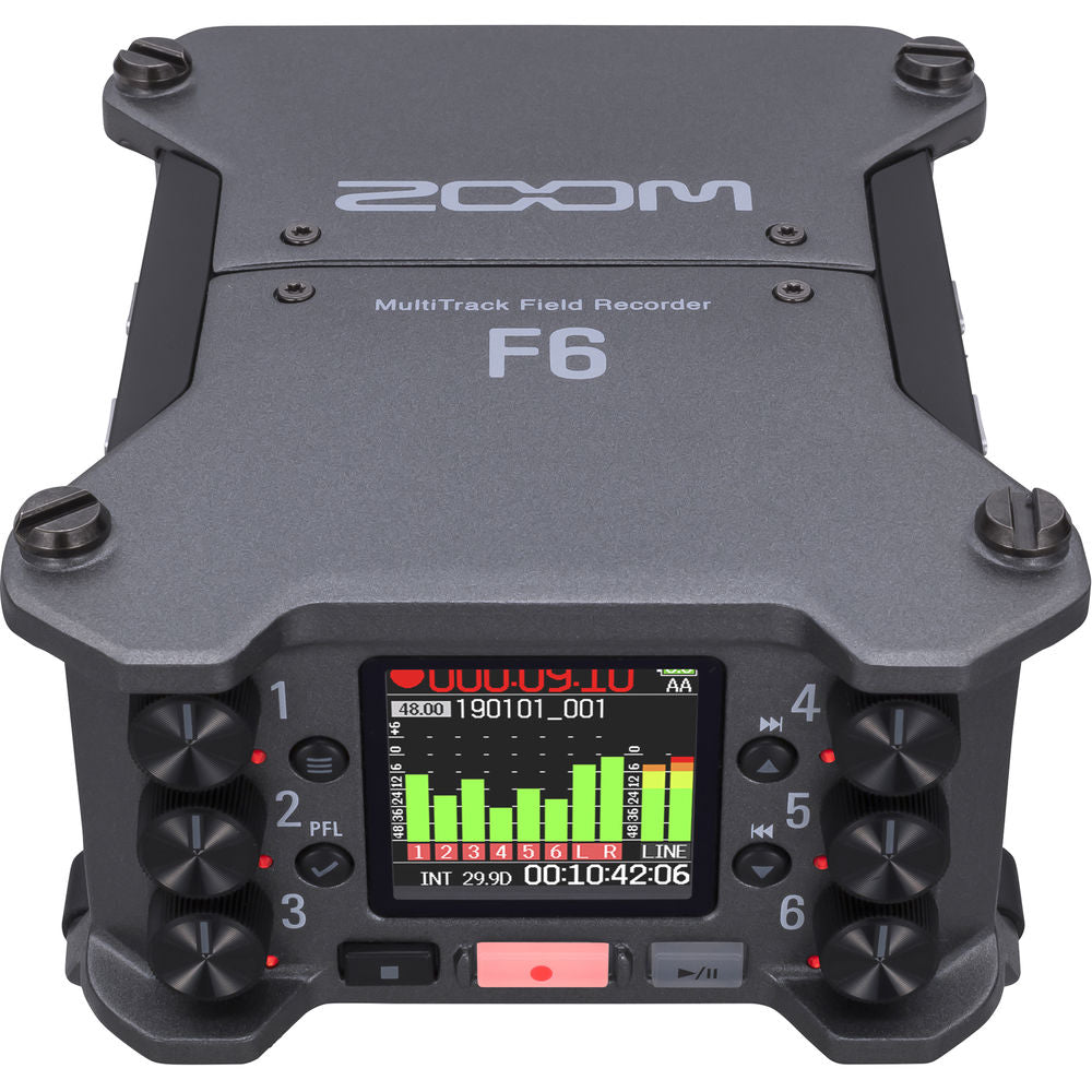 Zoom F6 digital recorder with multiple input channels and LCD display, shown on a clean surface.