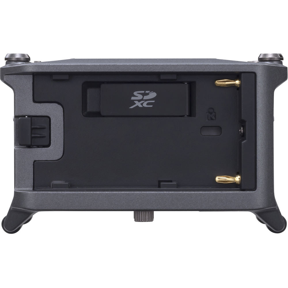 Zoom F6 digital recorder with multiple input knobs and LCD screen, showing professional audio recording features.