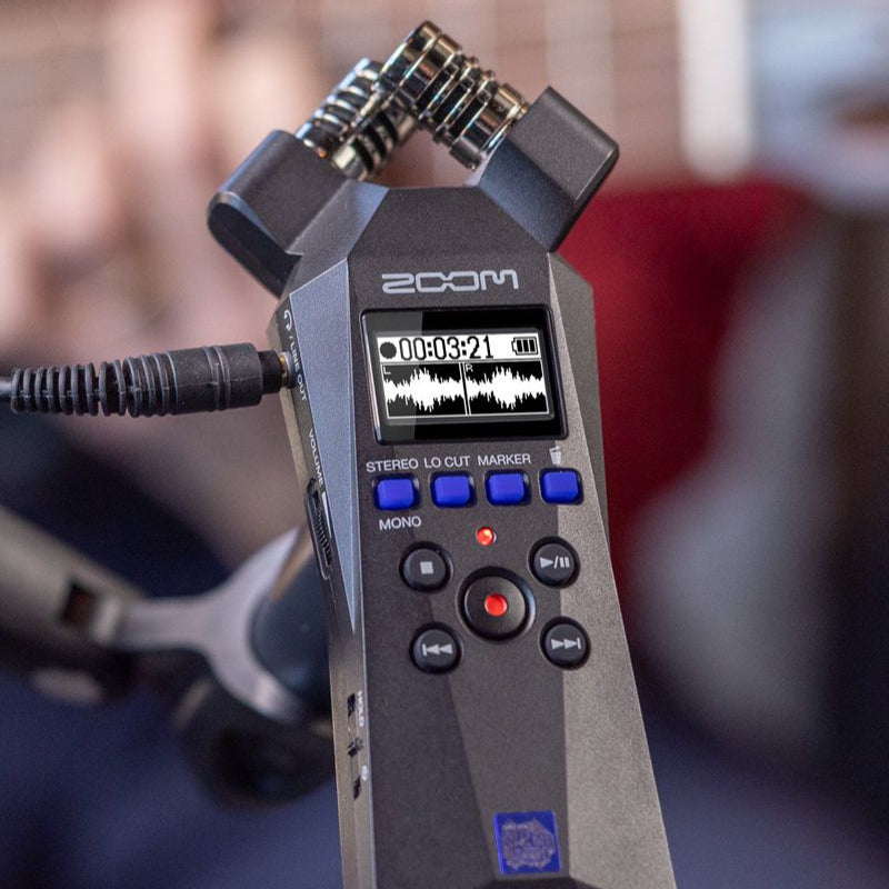 Zoom H1 Essential digital recorder with built-in microphones and compact design, ideal for on-the-go audio recording.