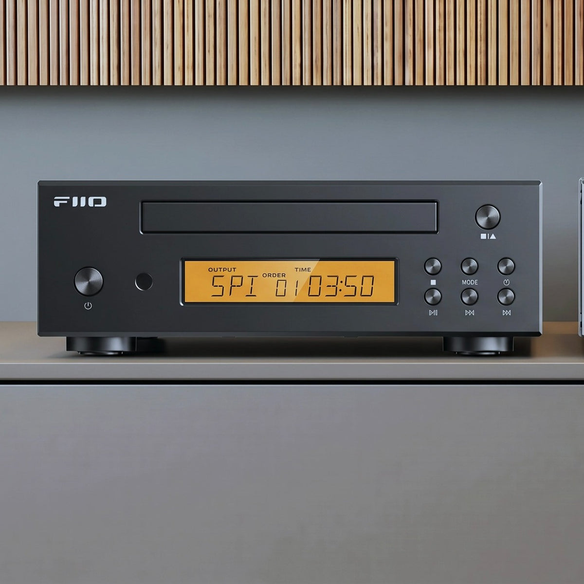 FiiO DP11 CD player in black on a living-room sideboard